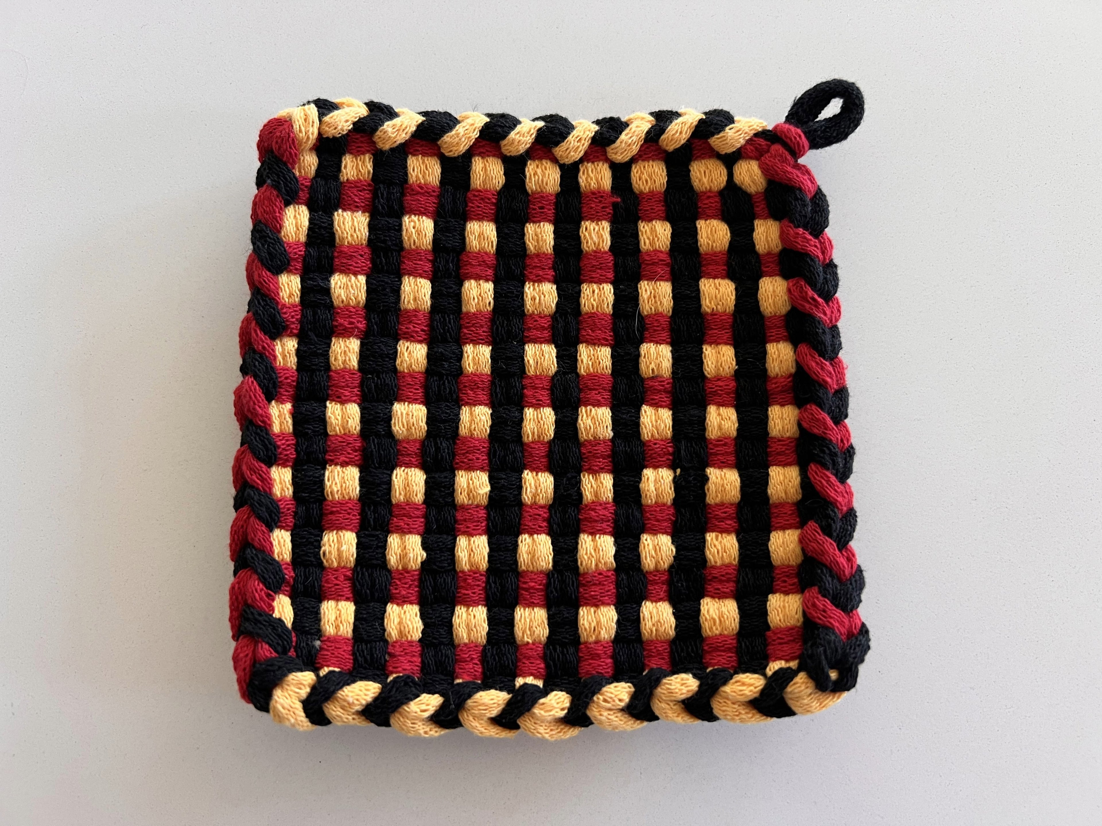 Handmade Loom Potholder – Bold Black with Red & Yellow Accents