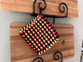Handmade Loom Potholder – Bold Black with Red & Yellow Accents